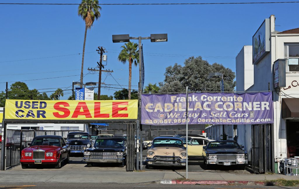 A used car lot where people go when buying a used car.