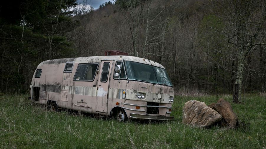 Abandoned Dodge van and other cars found throughout the woods and downtown area in Asheville, North Carolina