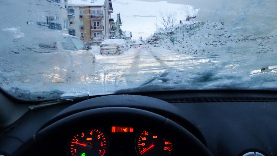 A frozen car windshield in the winter