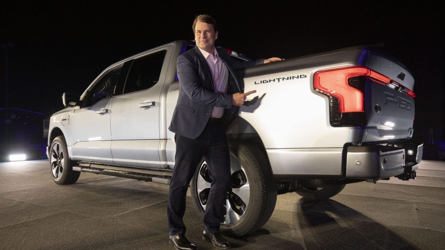 Jim Farley, the CEO of Ford, poses with the F-150 Lightning