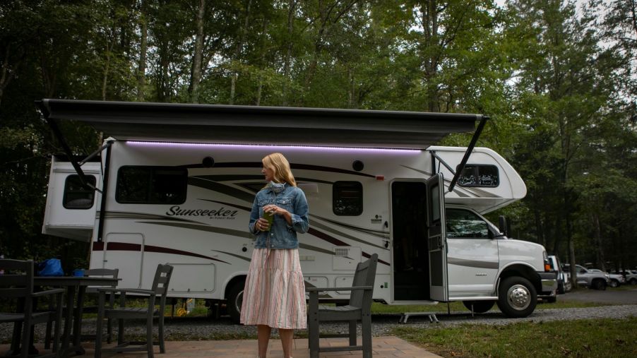 Washington Post travel writer Andrea Sachs with a rented RV parked at a KOA campground