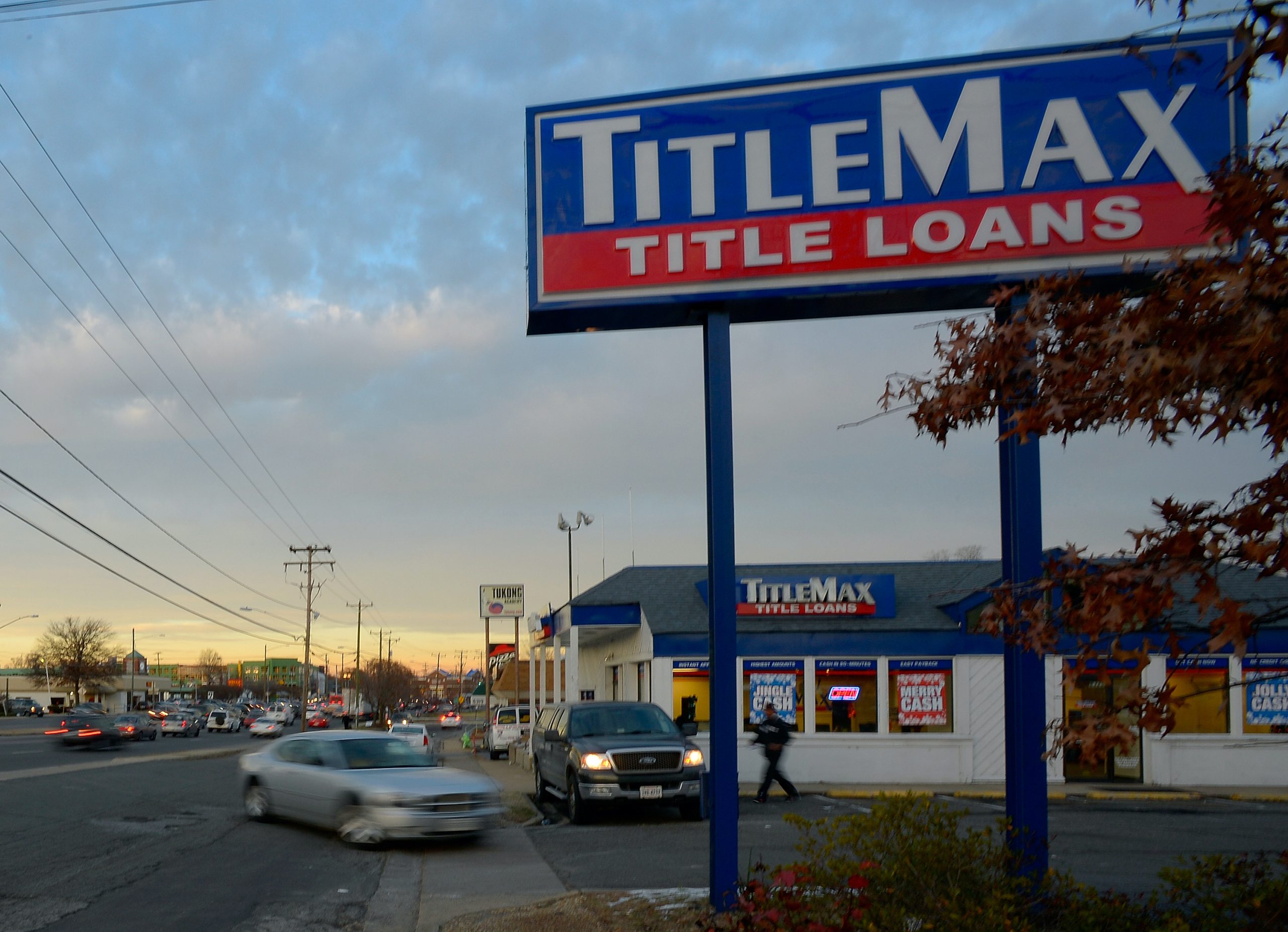 A TitleMax store sign on the side of the road.