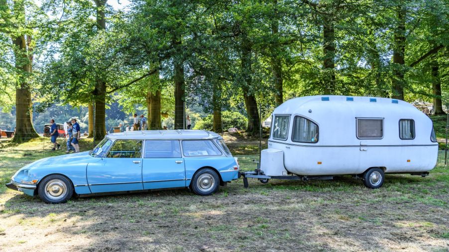 A Citreon DS station wagon with an attached travel trailer at the 2019 Concours d'Elegance in Baarn, Netherlands