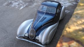 The blue-and-silver 1937 Talbot-Lago T150-C-SS Teardrop Coupe Chassis #90107 parked on a road