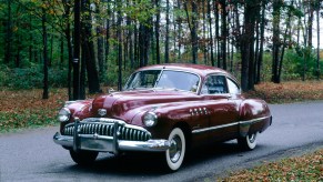 1949 Buick Roadmaster in red shot from front end on a forest road