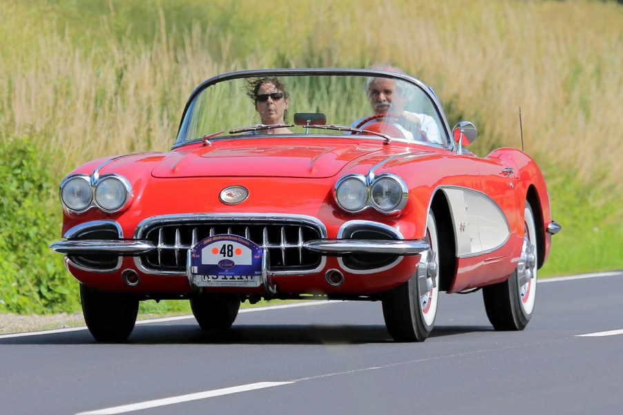 front end shot of 1959 Chevrolet Corvette driving down the road