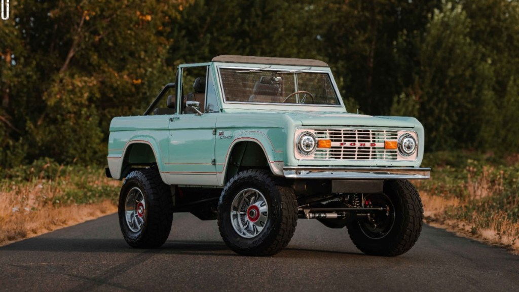 Green 1969 Ford Bronco converted from a gas-powered car to an electric vehicle via LegacyEV
