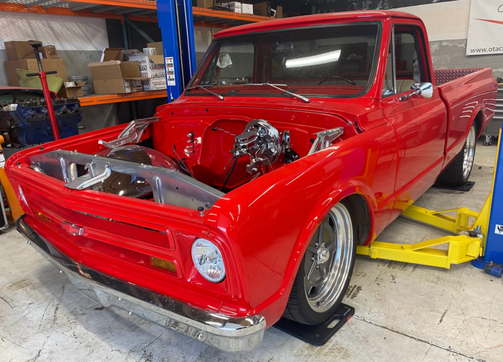 Red 1971 Chevy C-10 converted from a gas-powered car to an electric vehicle via Legacy EV