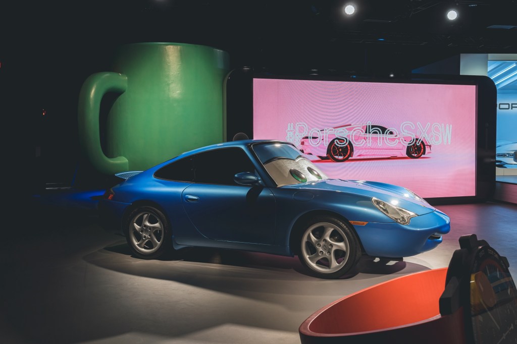 The blue 1999 Porsche 911 Carrera modified like Sally Carrera at SXSW 2022