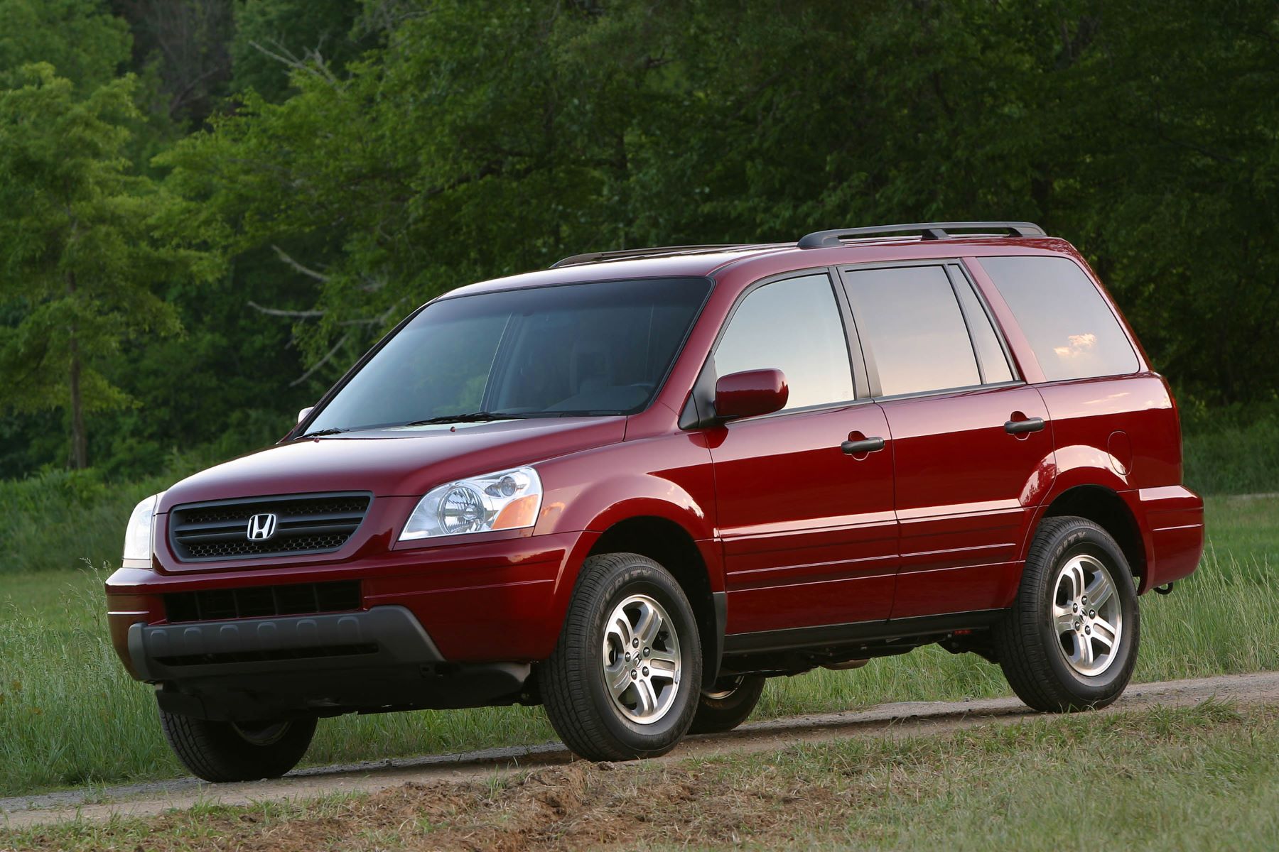 2003 Honda Pilot EX three-row mid-size crossover SUV in red is one of the worst Honda Pilot models