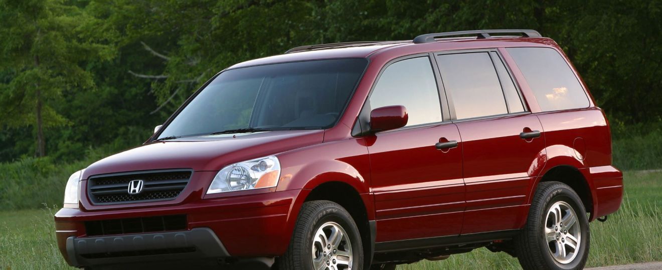 2003 Honda Pilot EX three-row mid-size crossover SUV in red is one of the worst Honda Pilot models