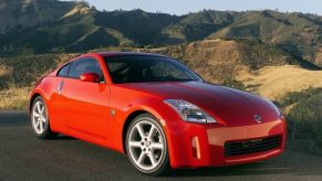 A red 2005 Nissan 350Z on a canyon road