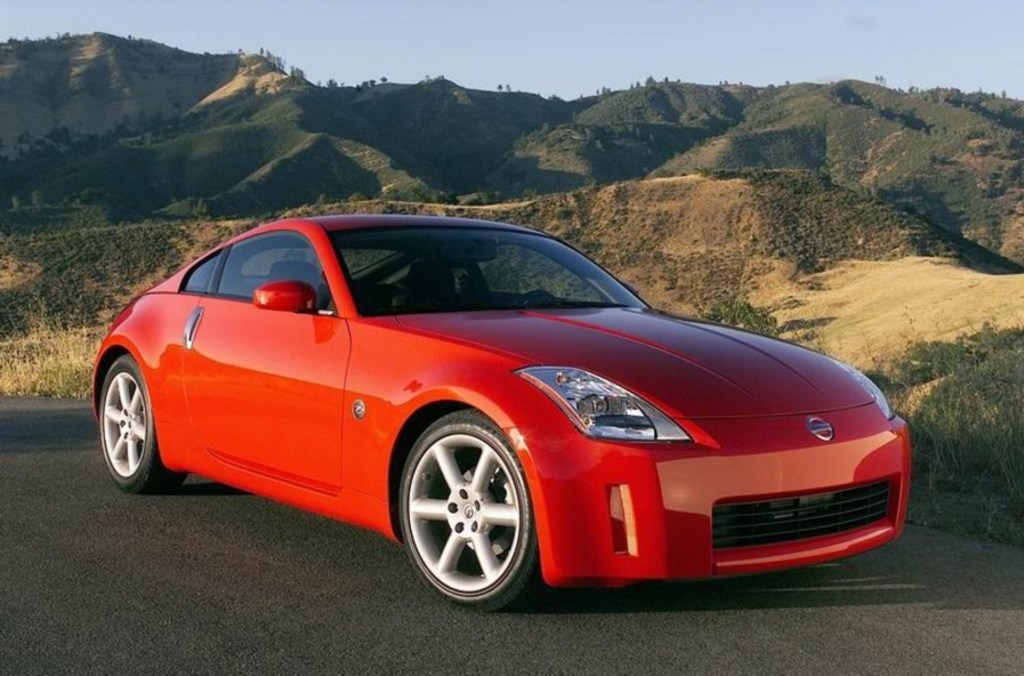 A red 2005 Nissan 350Z on a canyon road