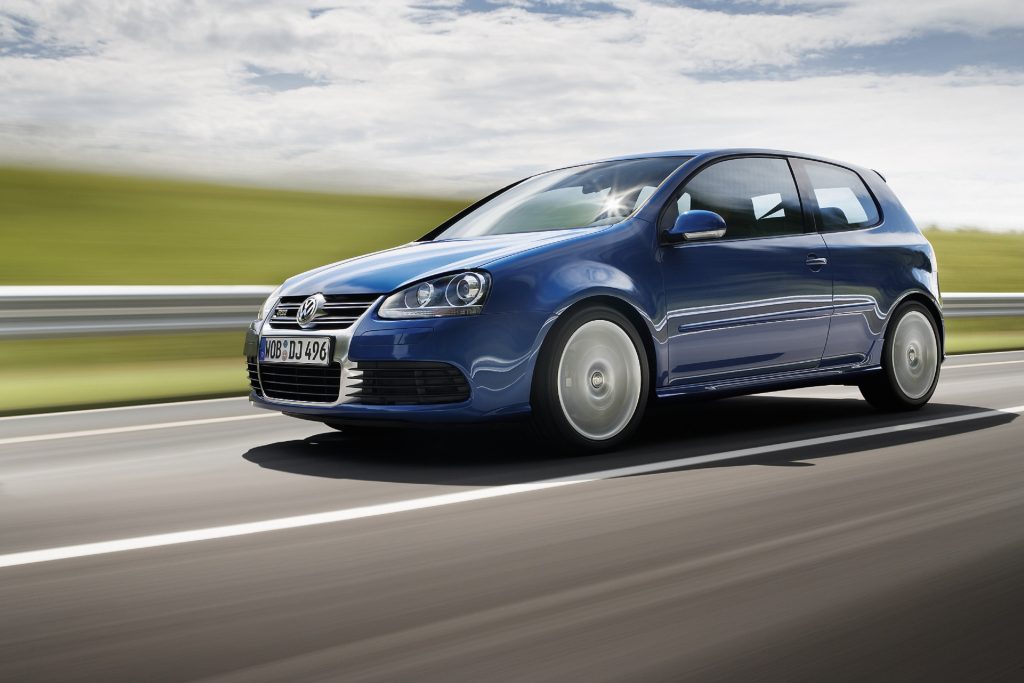 A blue US-market 2008 Volkswagen R32 drives down a road