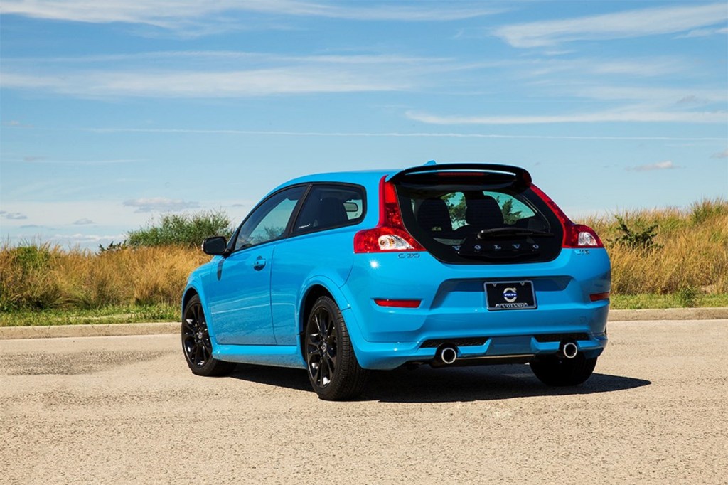 The rear 3/4 view of a blue 2013 Volvo C30 R-Design Polestar Limited Edition on a racetrack