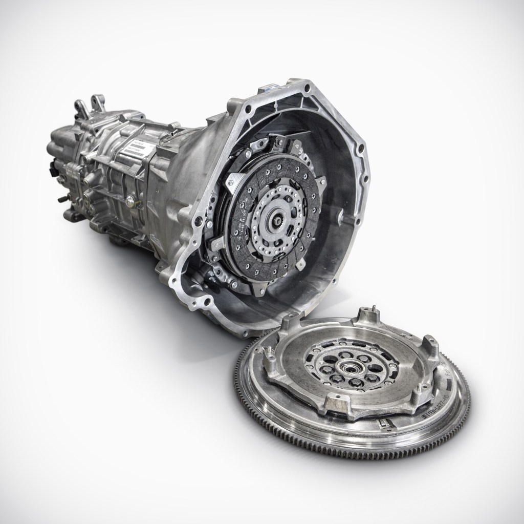 A 2015 Ford Shelby GT350 Mustang's manual transmission with dual-disc clutch attached and dual-mass flywheel separated