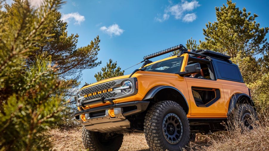 2021 Ford Bronco midsize SUV prototype with a gold yellow paint color and donut doors