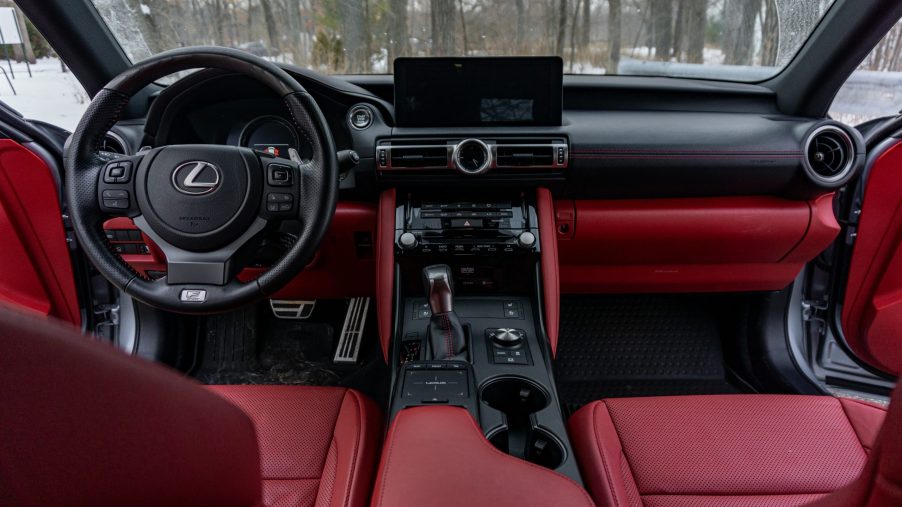 The red-and-black front seats and dashboard of a 2021 Lexus IS 350 F Sport AWD with Dynamic Handling Package