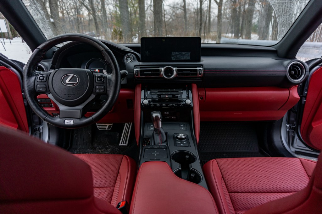 The red-and-black front seats and dashboard of a 2021 Lexus IS 350 AWD F Sport with Dynamic Handling Package