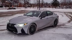 A gray 2021 Lexus IS 350 AWD F Sport with Dynamic Handling Package on a snowy parking lot