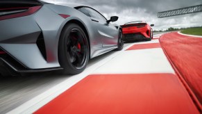 Close follow wheel shot on rumble strip as pair of 2022 Acura NSX Type S models race on track
