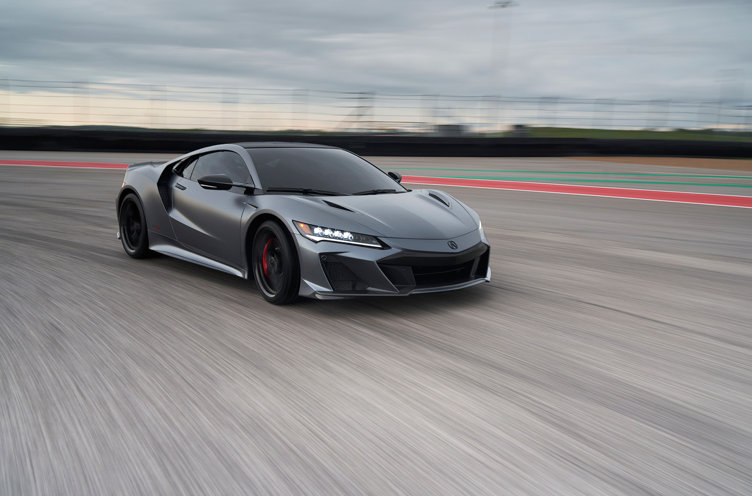 2022 Acura NSX Type S in matte grey on racetrack rolling shot 