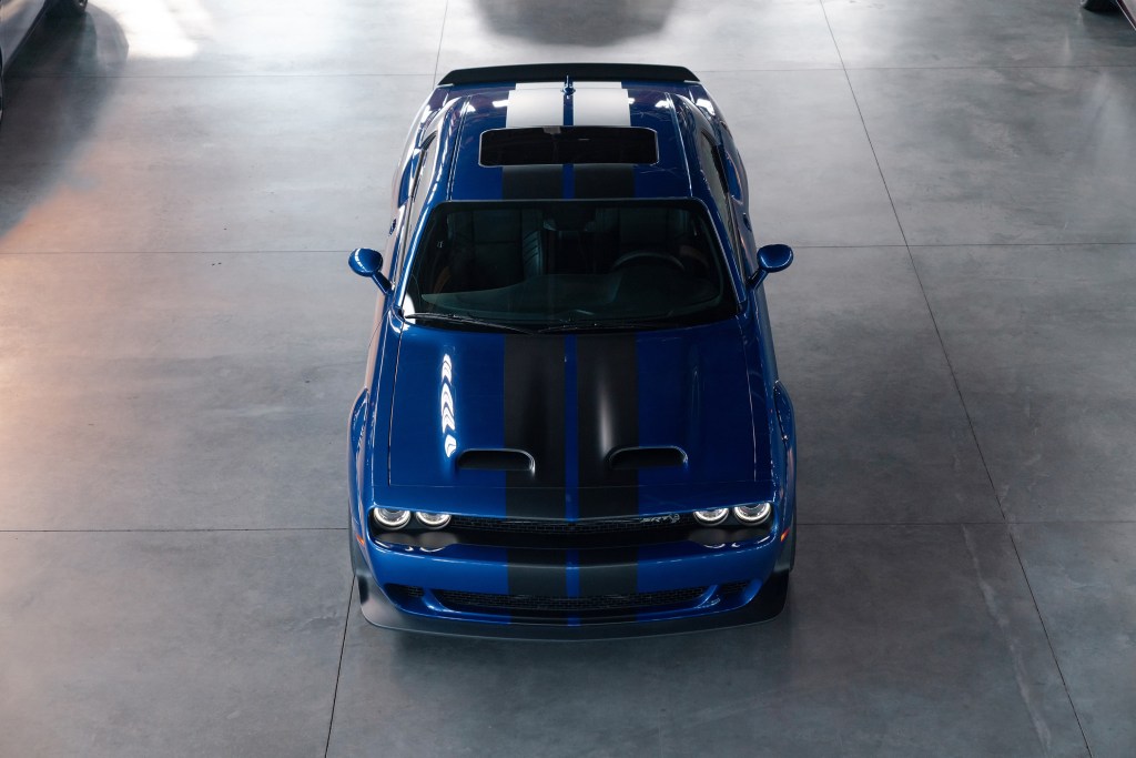 An overhead view of a blue-with-black-stripes 2022 Dodge Challenger SRT Hellcat Widebody