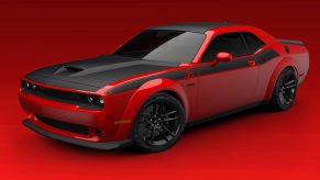 A red-and-black 2022 Dodge Challenger T/A 392 Widebody in a red studio
