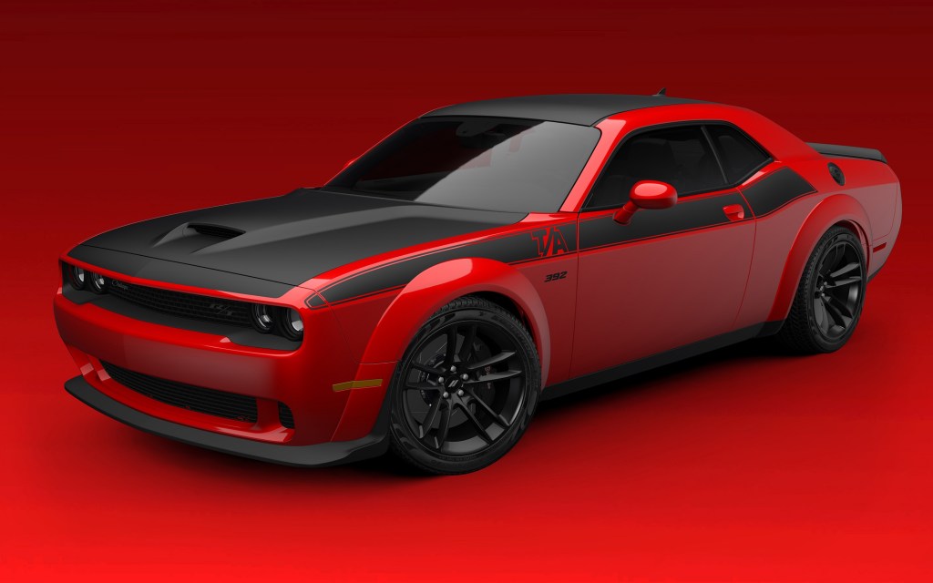 A red-and-black 2022 Dodge Challenger T/A 392 Widebody in a red studio