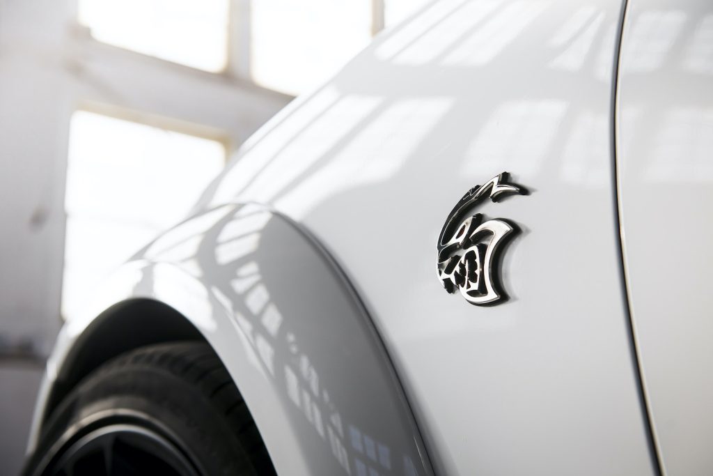 2022 Dodge Charger SRT badge on a white fender.