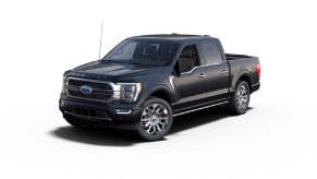A dark blue 2022 Ford F-150 Limited against a white background.