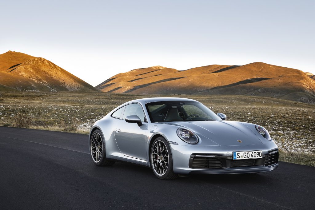 A silver 2022 Porsche 911 Carrera on a racetrack