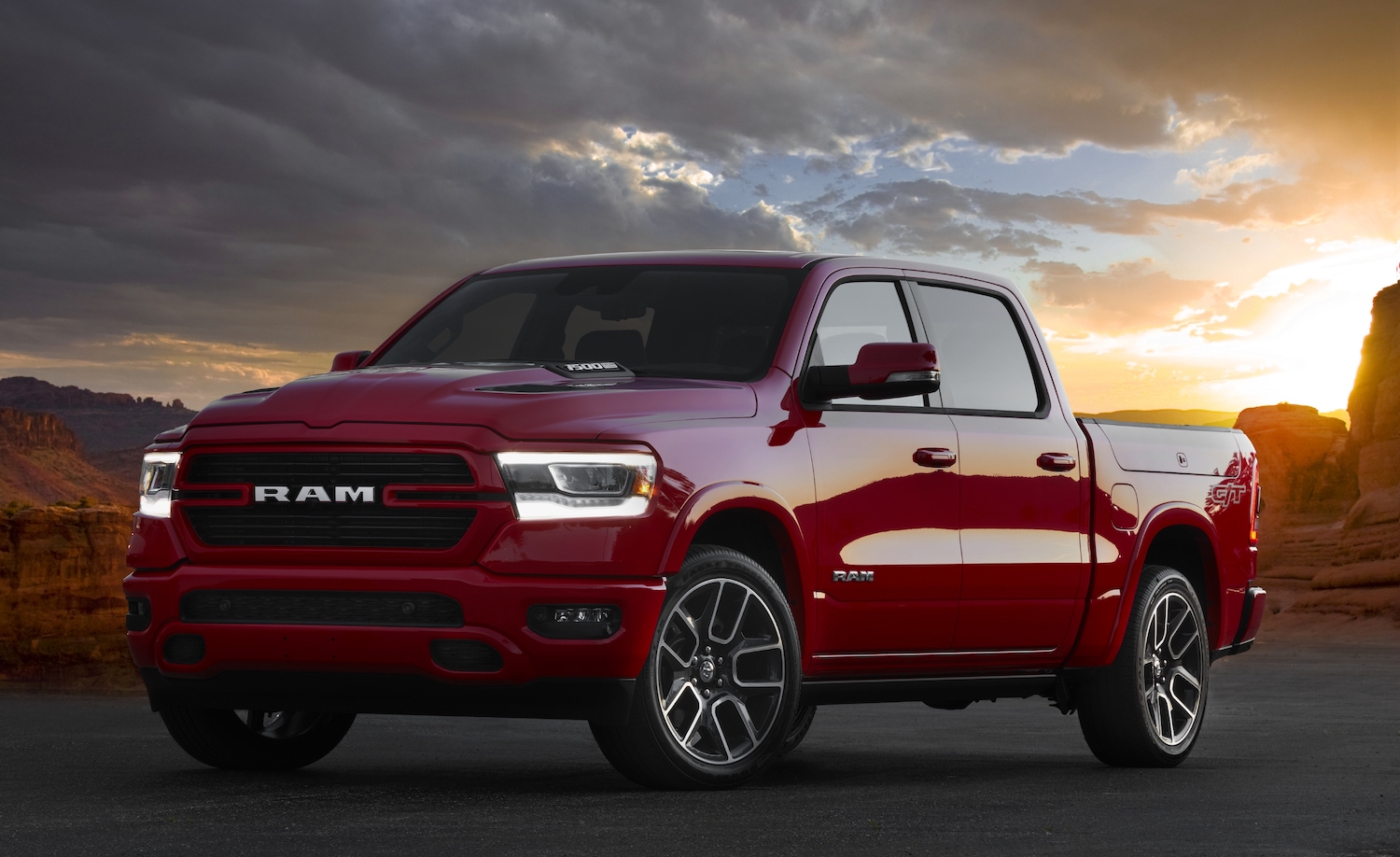 A red 2022 Ram 1500 against a sunset.