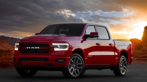 A red 2022 Ram 1500 against a sunset.