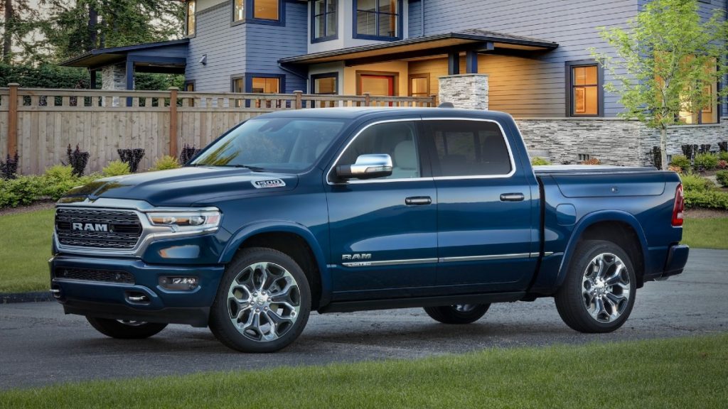 Blue 2022 Ram 1500 Limited in front of a house, one of the best luxury pickup trucks available