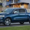 Blue 2022 Ram 1500 Limited in front of a house