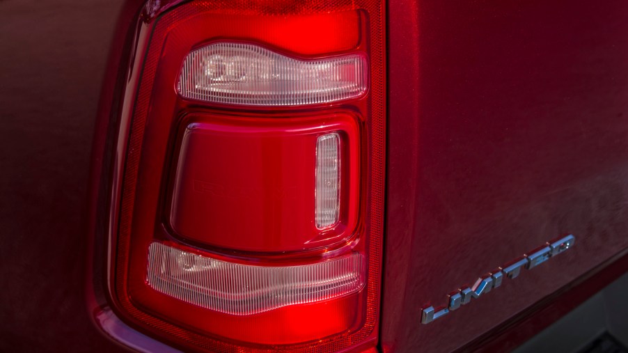 Detail shot of the taillight of a red 2022 pickup truck.
