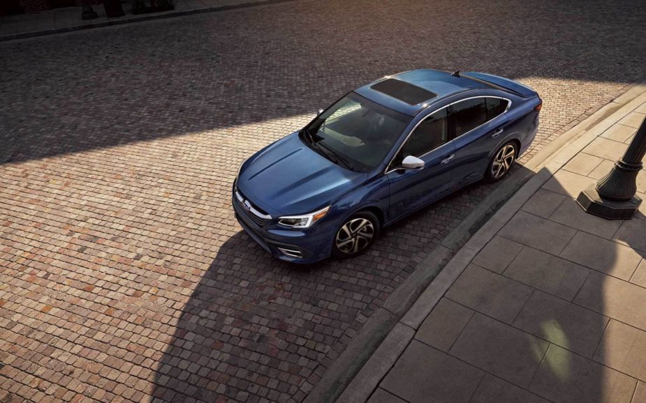 An overhead shot of the 2022 Subaru Legacy midsize sedan in blue parked on a cobblestone road