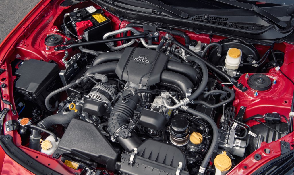 The 2.4-liter boxer engine in a red 2022 Toyota GR86 Premium