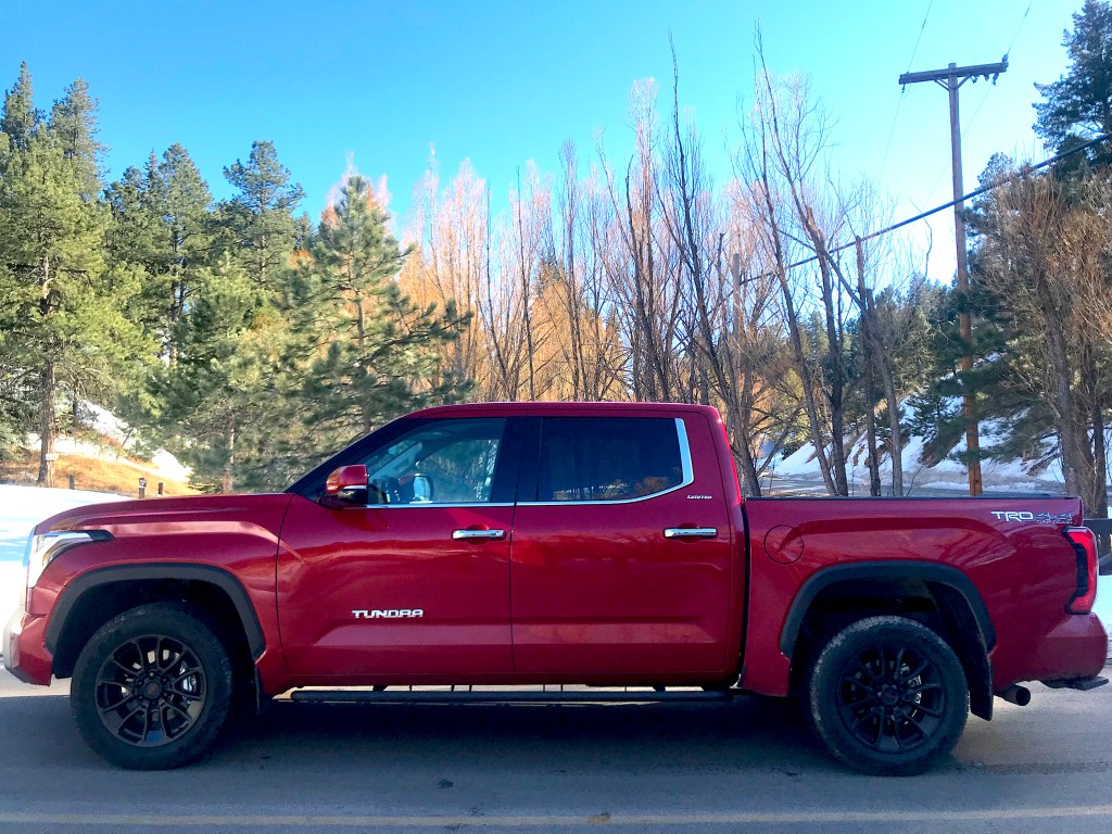 A side view of the 2022 Toyota Tundra with trees surrounding it