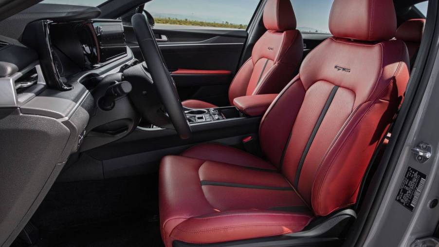 Interior of the 2022 Kia K5 GT-Line with red faux leather seats