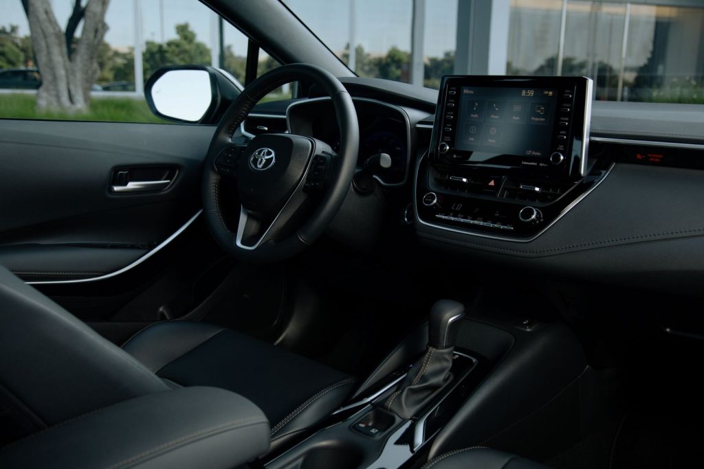All-black interior of a 2022 Toyota Corolla, with large infotainment screen