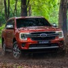 Orange 2023 Ford Everest on a trail in the woods
