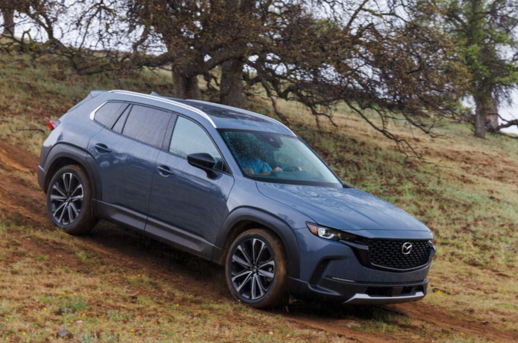 The 2023 Mazda CX-50 on a dirt road 