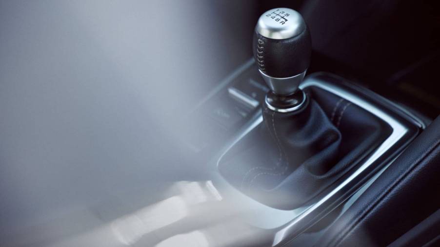 Close up view of a manual transmission shifter in the cabin of the 2023 Acura Integra A-Spec w/Technology Package