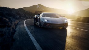 2022 Lamborghini Aventador Ultimae final edition driving on road in sunset