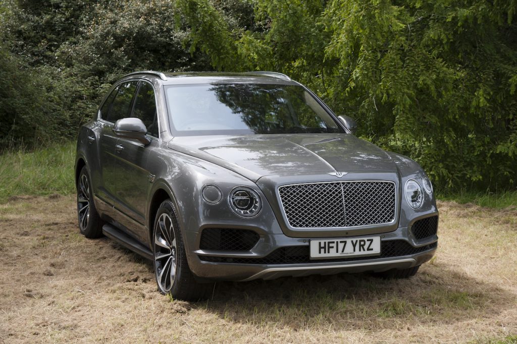Bentley Bentayga in grey parked in the grass