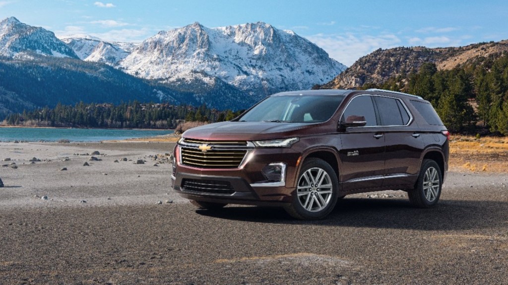 Black Cherry Metallic 2022 Chevrolet Traverse with mountains in the background