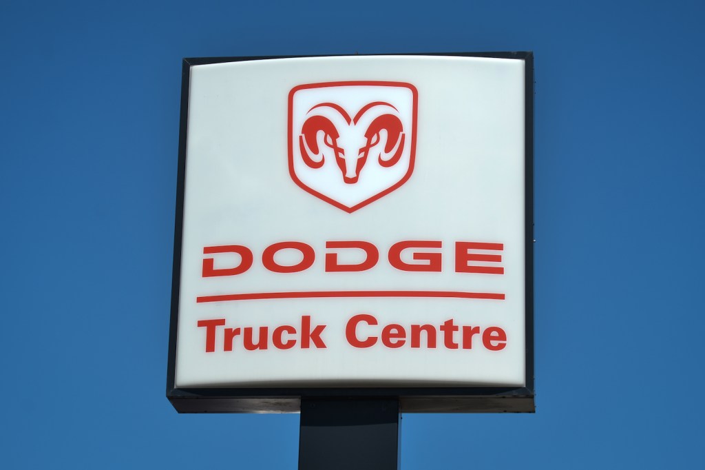 Closeup of a "Dodge Truck Centre" sign at a Ram dealership.