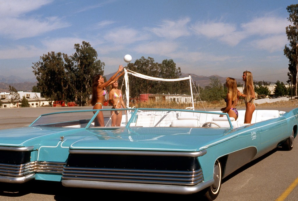 A group of women playing volleyball in the Jay Ohrberg double-wide limousine in the 1980s